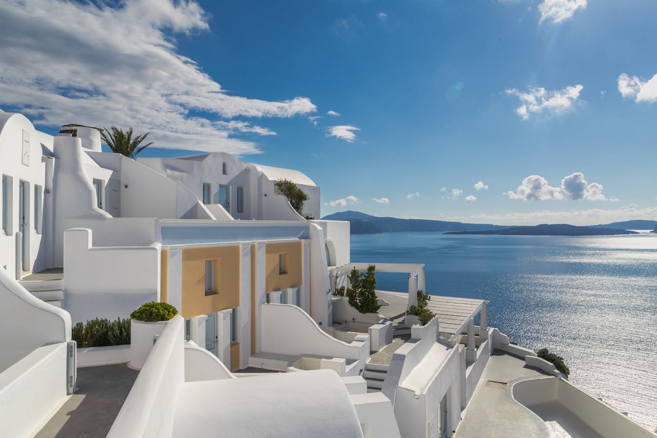 Breathtaking view of Santorini's iconic white architecture overlooking the sparkling Aegean Sea.
